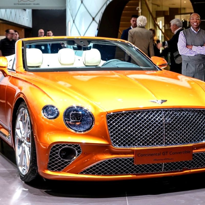 Orange Bentley Continental GT Convertible on display