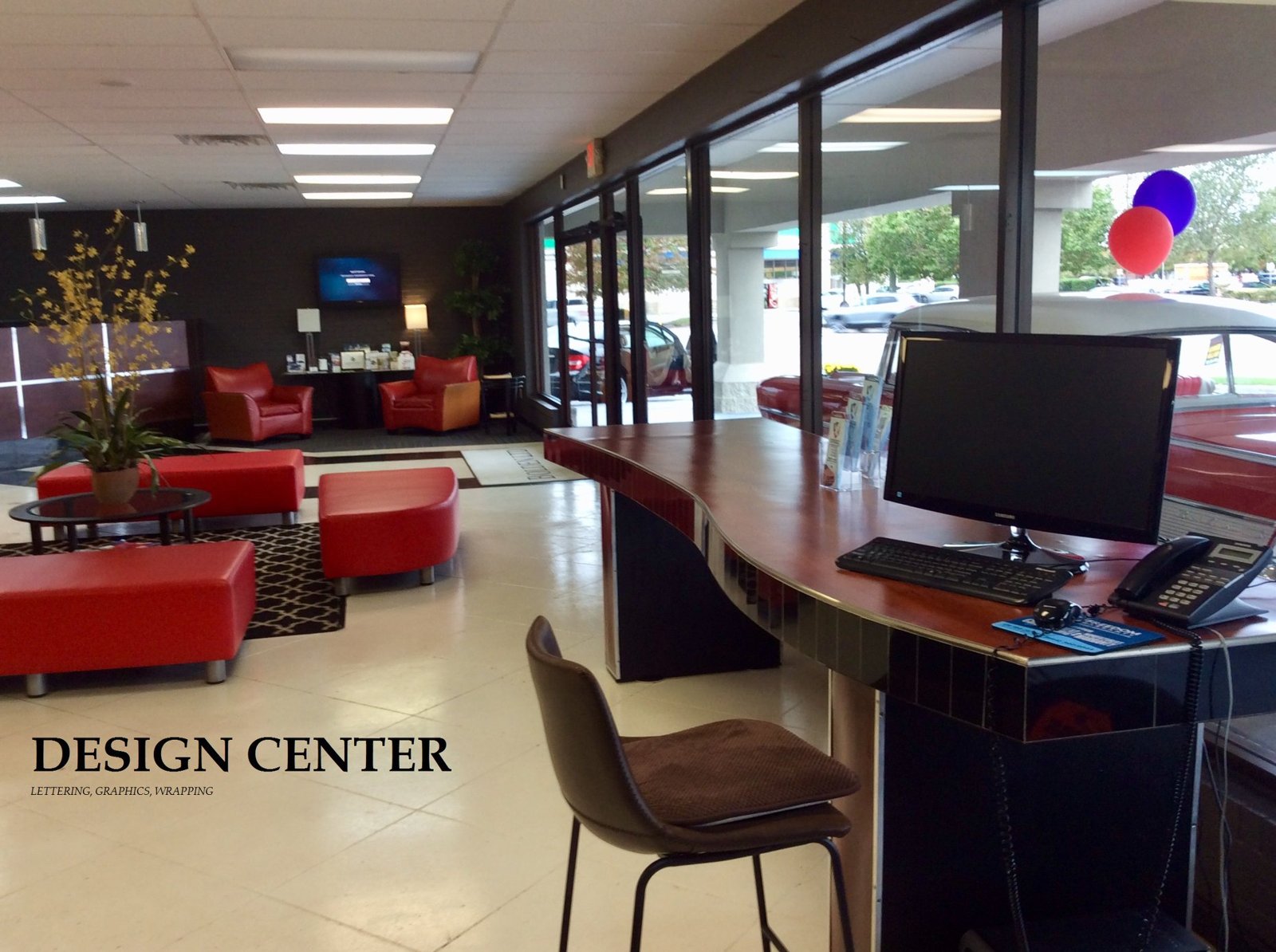 The Bolden Limited client lounge and design center, with red leather seating and a reception desk